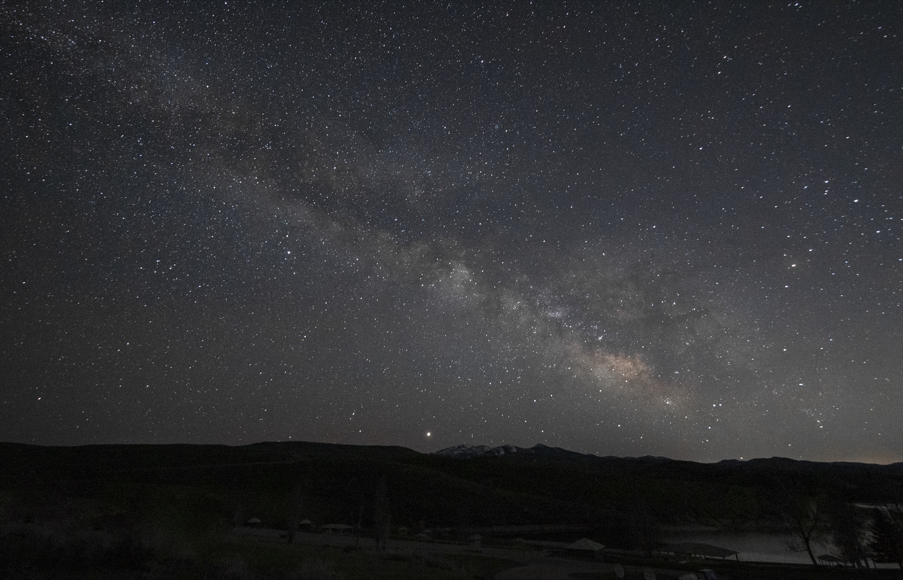 The Milky Way arching over East Canyon at Bryce Canyon, Utah on a moonless night